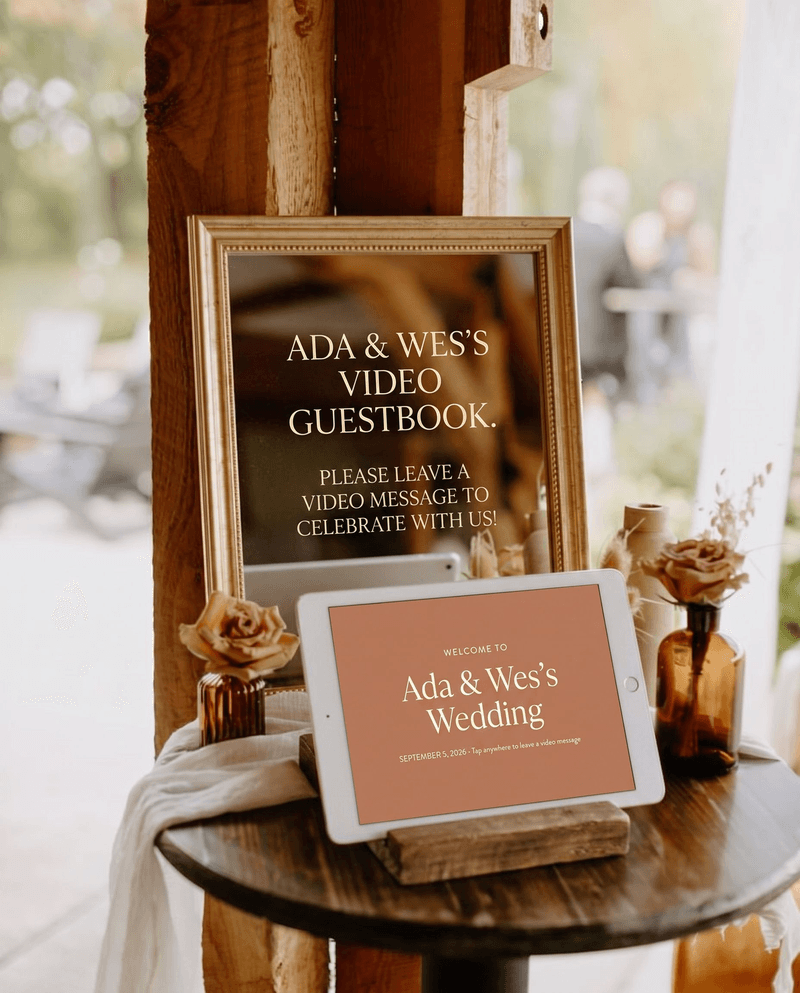 iPad video guestbook set up on a stand at a barn wedding